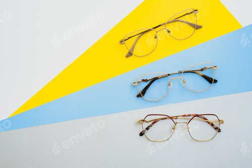 Preview: Stylish eyeglasses. Modern eyeglass frames on a colored background