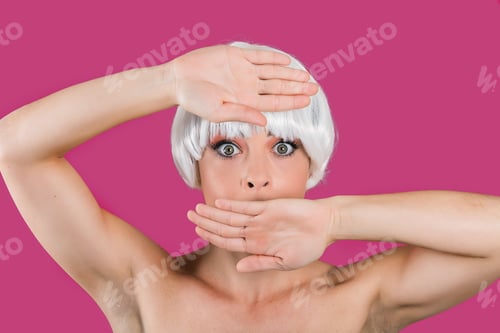 Preview: Young glam model covering mouth
