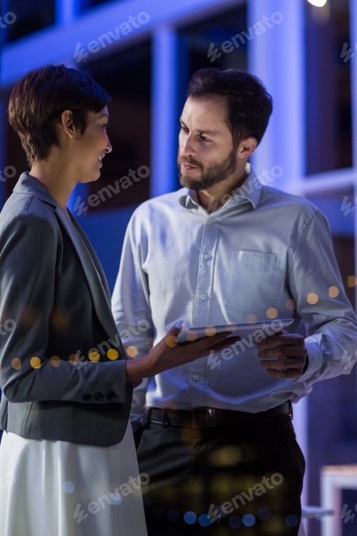 Preview: Businesspeople Interacting With Each Other While Using Digital Tablet