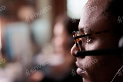 Preview: African american operator listening to client on helpline call