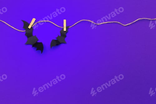 Preview: halloween and decoration concept - paper bats flying