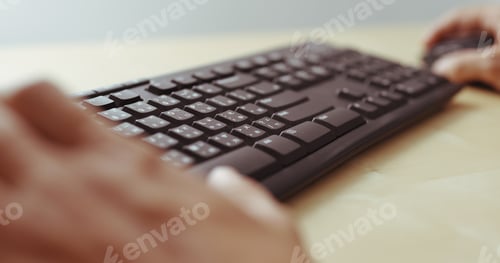 Preview: Man hands typing on a computer keyboard