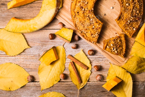 Preview: Pumpkin pancakes on a wooden background. Autumn food
