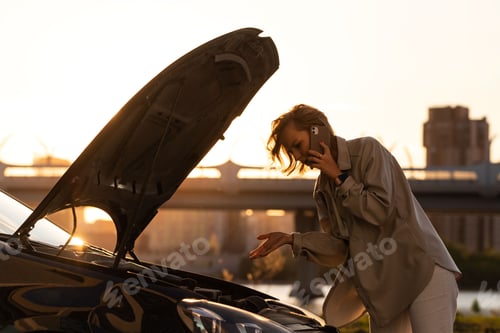Woman Calling for Assistance with Broken Car