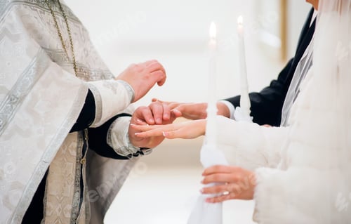 Preview: The priest puts on the ring at the wedding ceremony in the church