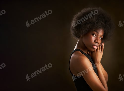 Preview: portrait of an attractive and empowered young black woman with a confident and seductive gaze