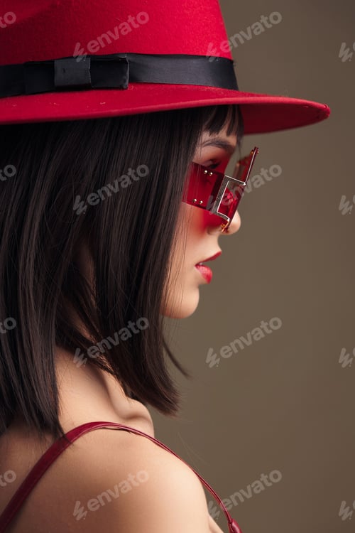 Preview: Woman, red hat, sunglasses a stylish woman in a vibrant red dress, accessorized with a matching red