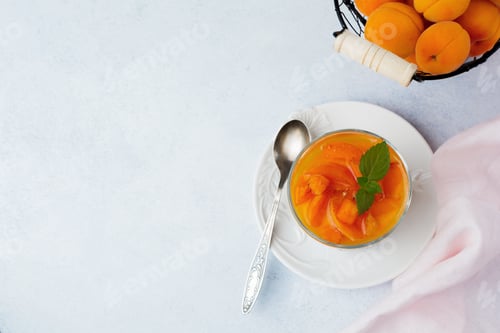 Preview: Dessert Chocolate biscuit, vanilla cream cheese and apricot jam in a glass bowl on a light backgroun