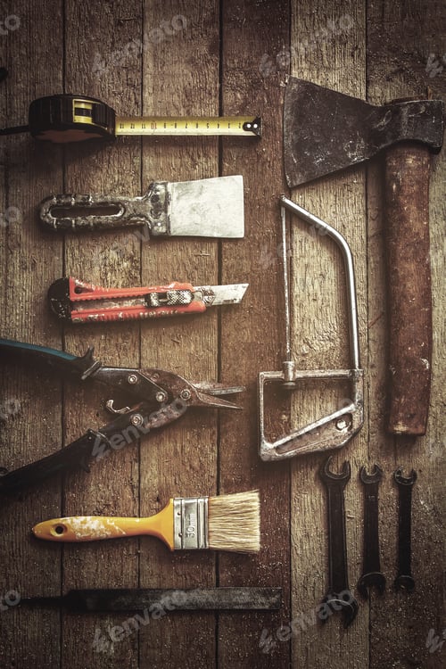 Preview: Old and dirty construction tools on wooden background