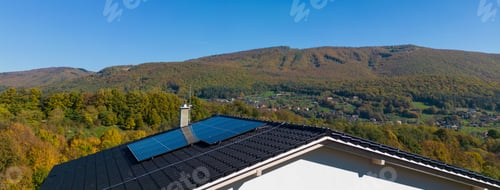 Preview: High angle view of solar photovoltaic panels on roof, alternative energy, saving resources and