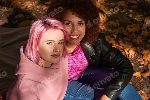 Preview: Interracial lesbian couple spending time together outdoors