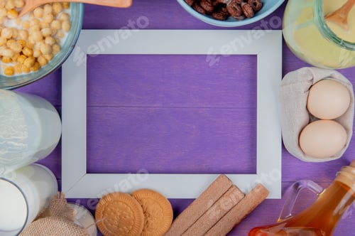 Preview: top view of milk products as milk, cream, condensed milk with cookies, eggs, butter, cereals around