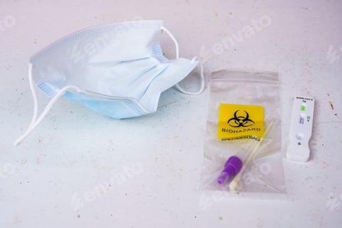 Preview: COVID rapid test and mask on table