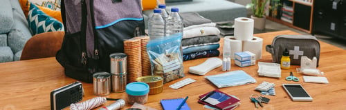 Preview: Emergency backpack equipment organized on the table