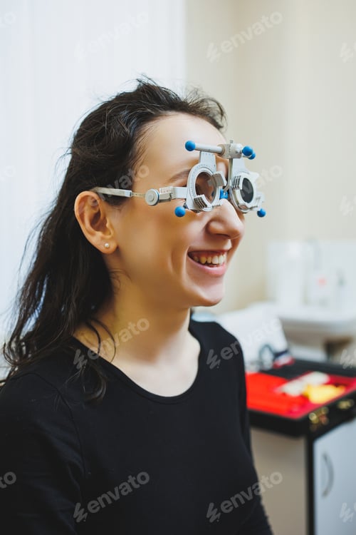 Preview: Eye examination of a young woman at an ophthalmologist's appointment using modern microscopes.