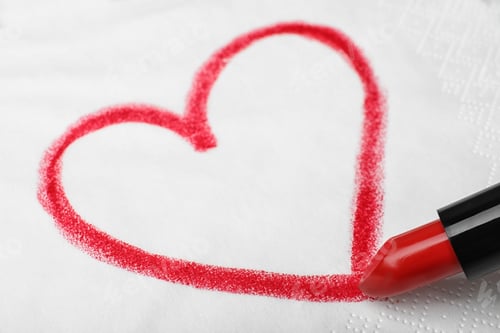 Preview: Drawing heart with lipstick on paper napkin