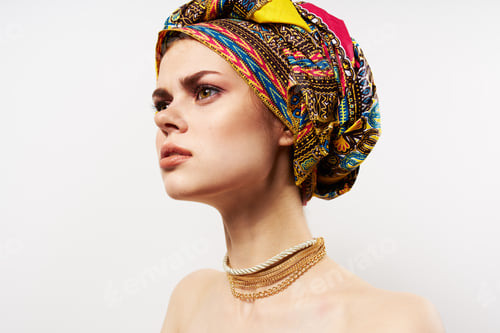 Preview: attractive woman multicolored traditional turban close-up isolated background