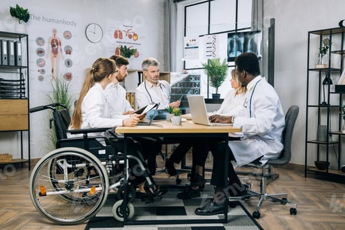 Preview: Multiracial doctors working on medical research at office