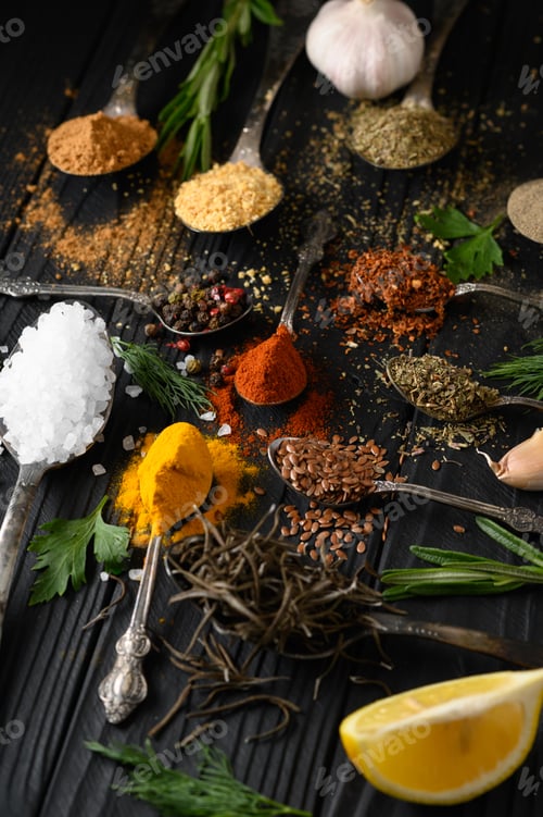 Preview: Colorful various herbs and spices for cooking on dark wooden rustic background