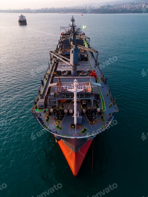 Preview: A massive cargo ship wood chips carrier in the sea, aerial view
