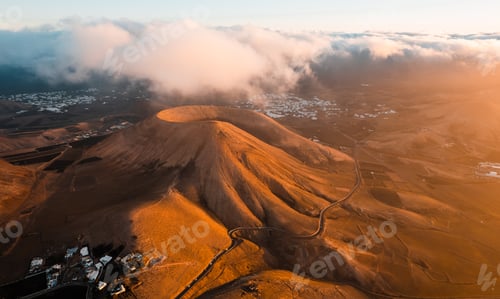 Preview: Volcanoes in Lanzarote at sunrise. Aerial view of Caldera Riscada. Canary Islands, Spain