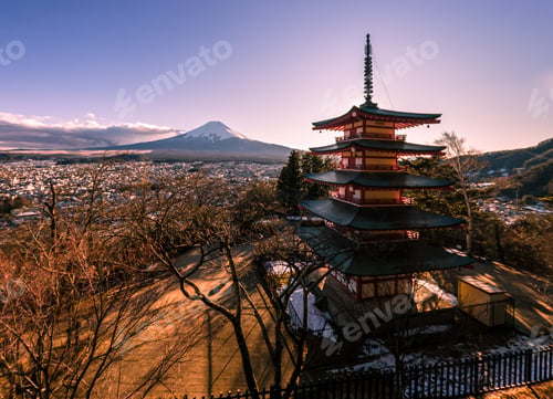 Preview: Beautiful Mt. Fuji with snow cover on top viewed from behind Chureito Pagoda