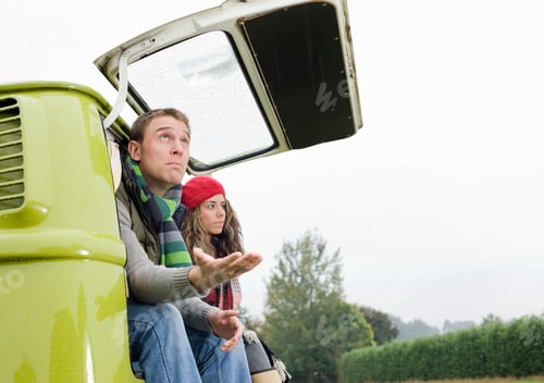 Preview: Couple at back of camper van