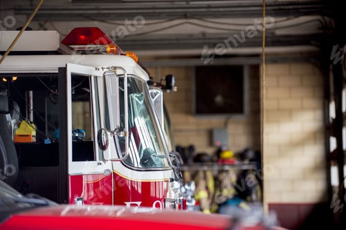 Preview: Closeup shot of a firetruck with an open door and a blurred background