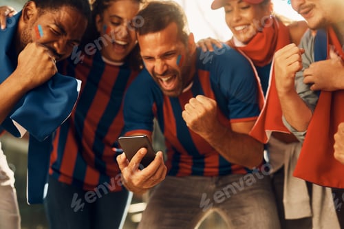 Preview: Excited soccer fans celebrating winning goal of favorite team while watching match on smart phone.