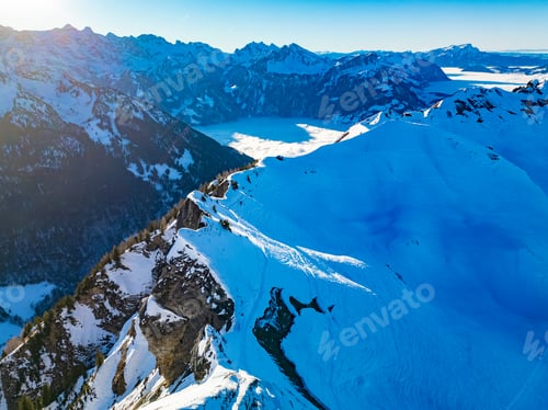Preview: Aerial drone view of snow covered ski slopes at Stoos,Switzerland