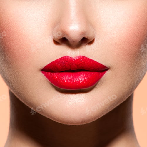 Preview: Woman lips with a red lipstick on lips. Closeup female red lips.