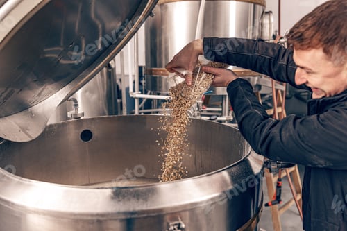 Preview: Brewmaster pouring malt seeds