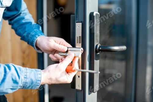 Preview: Man changing core of a door lock