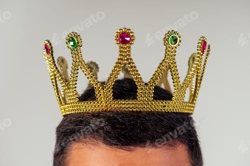 Preview: Portrait of a smiling bearded business man with a golden crown
