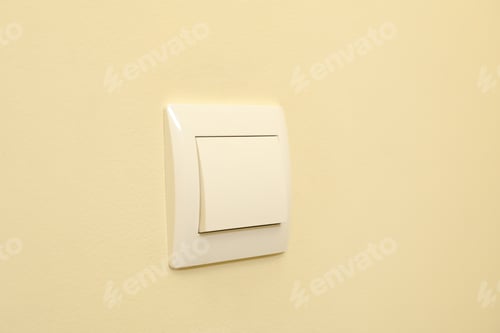 Preview: On-Off light switch on the beige wall