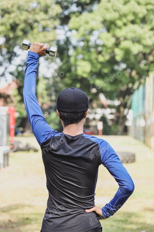Preview: Male athlete doing stretching exercise