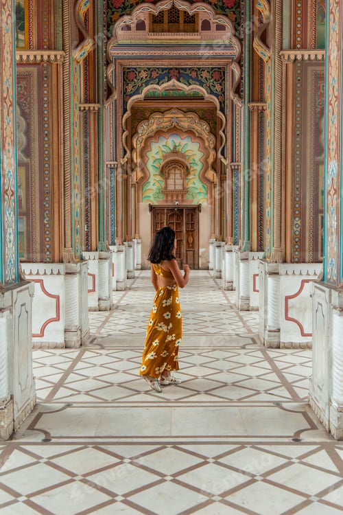 Preview: Tourist walking in ornate corridor of Jaipur City Palace, Rajasthan, India