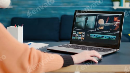 Preview: Multimedia designer using software to edit video footage