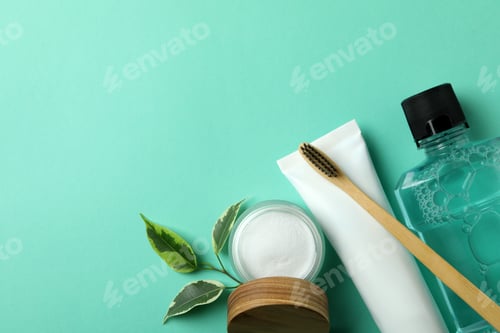 Preview: Oral care accessories on mint background, space for text