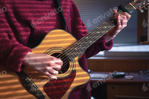 Preview: Girl with a guitar in the sunlight through the blinds.