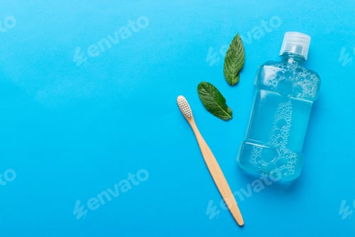 Preview: Mouthwash and fresh mint on colored background, top view with copy space for text