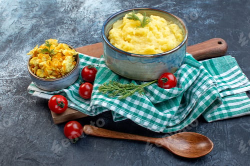 Preview: Side view of mashed potatoes served with dill and delicious dish fresh tomatoes on green stripped