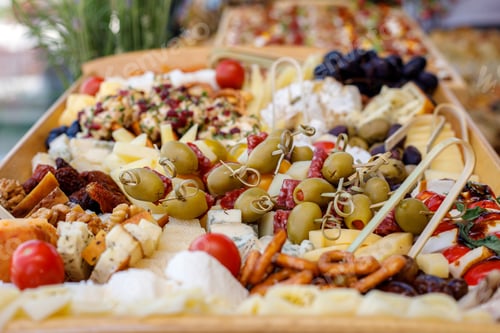Preview: Elegant cheese and charcuterie spread at a summer gathering