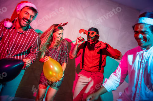 Preview: Group of friends dancing at New Year's Eve party