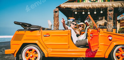 Preview: Man with map in car showing direction