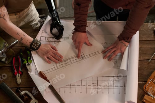 Preview: Unrecognizable Engineers Working With Technical Drawing