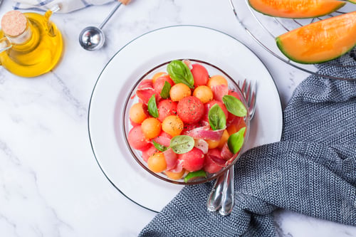 Preview: Fruit salad with melon cantaloupe, watermelon and prosciutto