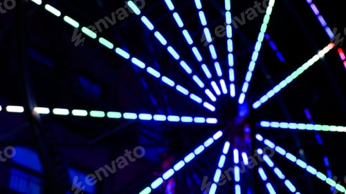 Preview: Closeup of lights on a Ferris wheel at night