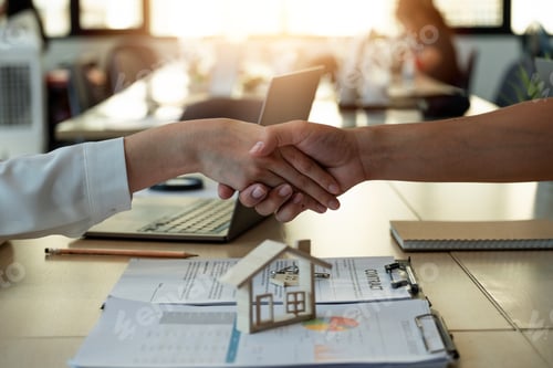 Preview: Handshake a successful real estate transaction in an office. Business people shake hands after
