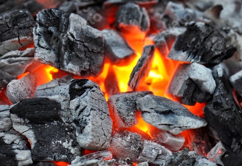Preview: Lose-up of burning barbecue coals in bright red color
